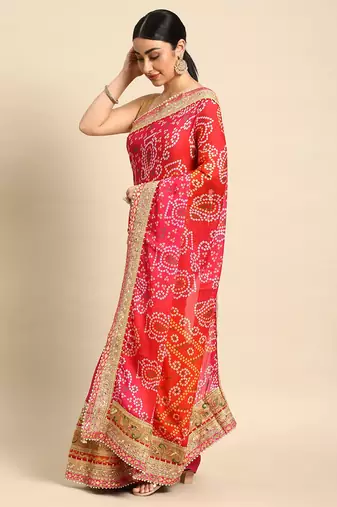 Pink bandhani saree with lace border and unstitched blouse piece