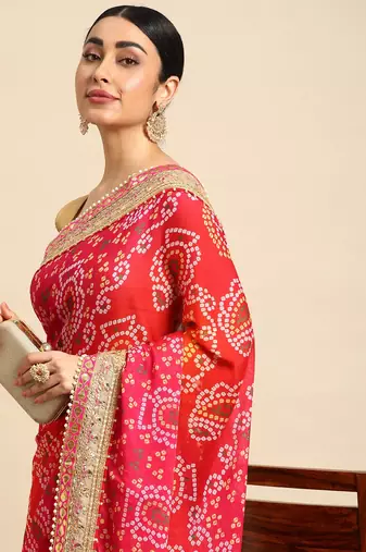 Pink bandhani saree with lace border and unstitched blouse piece