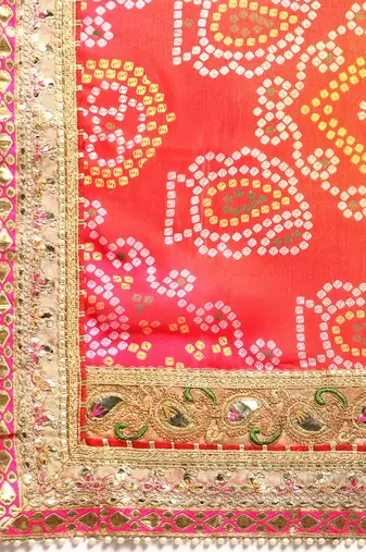 Pink bandhani saree with lace border and unstitched blouse piece