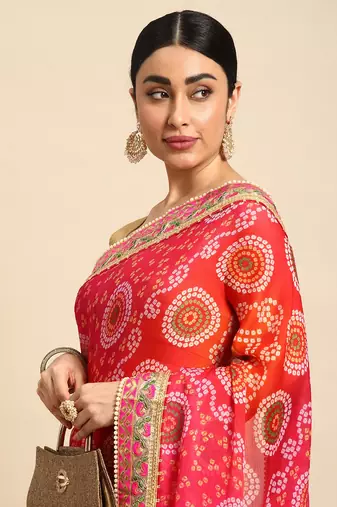 Orange bandhani saree with lace border and unstitched blouse piece
