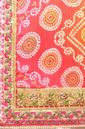 Orange bandhani saree with lace border and unstitched blouse piece