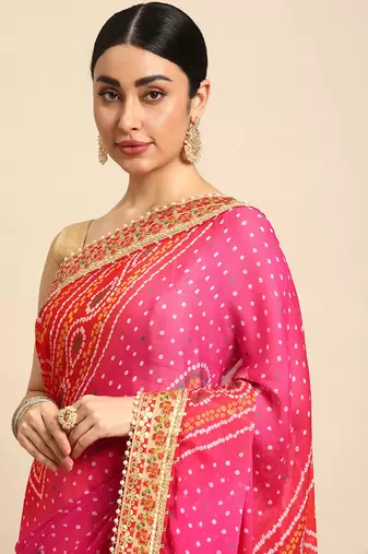 Yellow bandhani saree with lace border and unstitched blouse piece