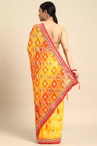 Yellow bandhani saree with lace border and unstitched blouse piece