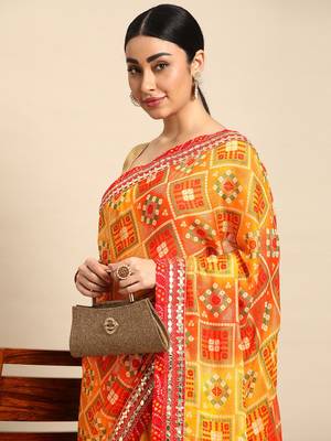 Yellow bandhani saree with lace border and unstitched blouse piece 3