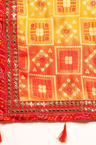 Yellow bandhani saree with lace border and unstitched blouse piece