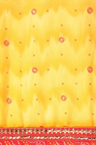 Yellow bandhani saree with lace border and unstitched blouse piece