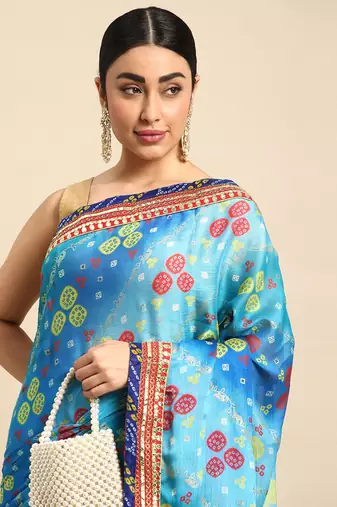Blue bandhani saree with lace border and unstitched blouse piece
