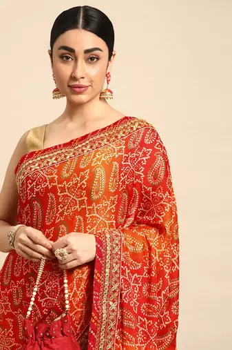 Orange bandhani saree with lace border and unstitched blouse piece