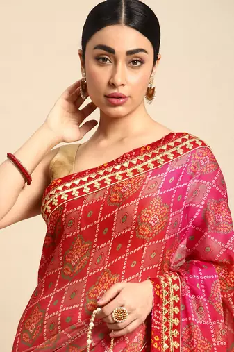 Red bandhani saree with lace border and unstitched blouse piece