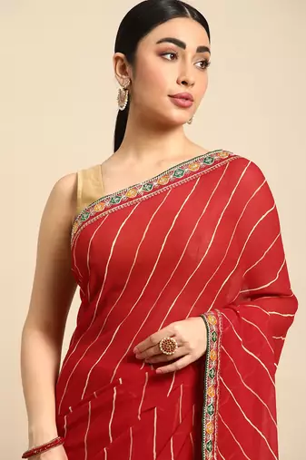 Red leheriya saree with lace border and  unstitched blouse piece