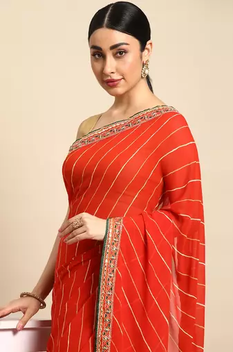 Orange leheriya saree with lace border and  unstitched blouse piece