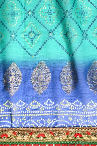 Blue  bandhani saree with lace border and unstitched blouse piece