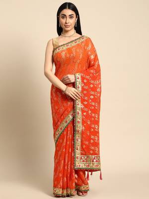 Orange bandhani saree with lace border and unstitched blouse piece 1