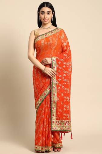 Orange bandhani saree with lace border and unstitched blouse piece