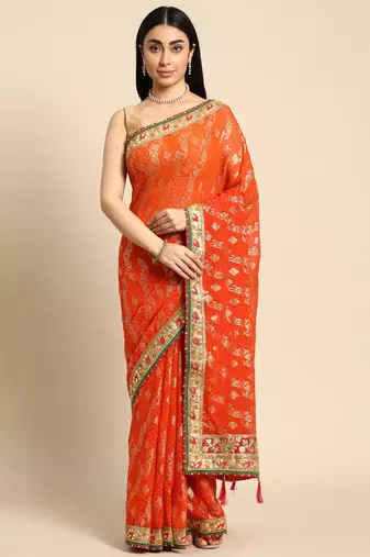 Orange bandhani saree with lace border and unstitched blouse piece