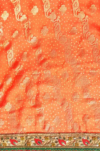 Orange bandhani saree with lace border and unstitched blouse piece