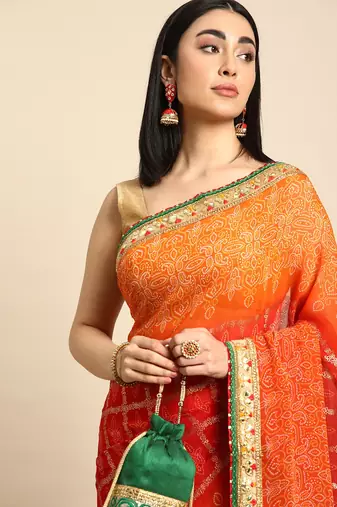 Orange bandhani saree with lace border and unstitched blouse piece