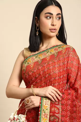 Red  bandhani saree with lace border and unstitched blouse piece