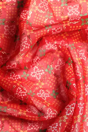 Red  bandhani saree with lace border and unstitched blouse piece