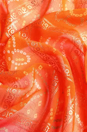 Red  bandhani saree with lace border and unstitched blouse piece