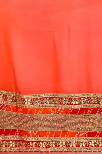 Red bandhani saree with lace border and unstitched blouse piece