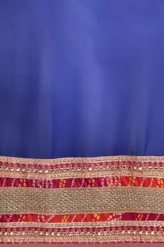 Blue bandhani saree with lace border and unstitched blouse piece