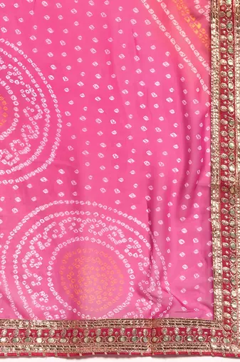 Pink bandhani saree with lace border and unstitched blouse piece