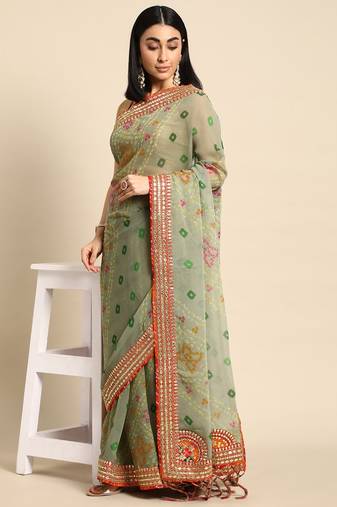 Green bandhani saree with lace border and unstitched blouse piece