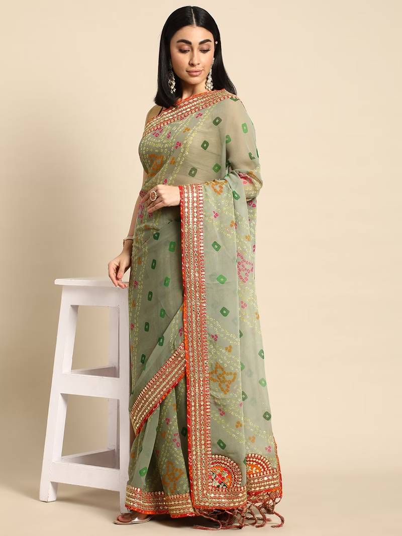 Green bandhani saree with lace border and unstitched blouse piece