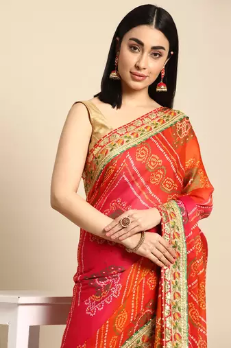 Pink bandhani saree with lace border and unstitched blouse piece
