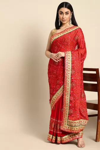 Red bandhani saree with lace border and unstitched blouse piece