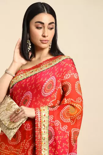 Orange bandhani saree with lace border and unstitched blouse piece