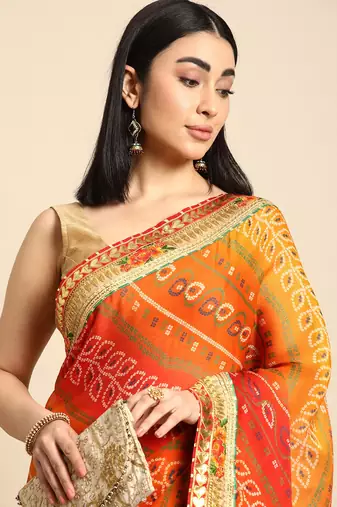 Pink bandhani saree with lace border and unstitched blouse piece