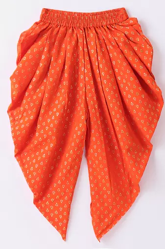 Twisha Girls Solid Knit Top Embellished With Pompom & Potali Buttons With Motif Foil Printed Dhoti-Red & Orange