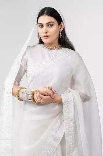 White dori embroidered organza silk saree