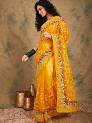 Yellow color embroidery work net saree with blouse 3