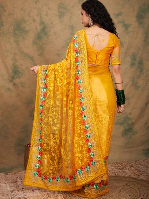 Yellow color embroidery work net saree with blouse 5