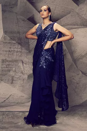 The shimmering blue skirt saree