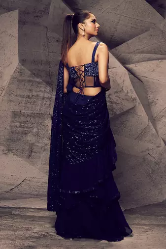 The shimmering blue layered saree