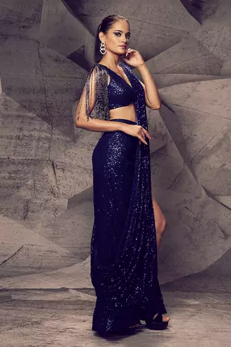 The shimmering blue slit saree