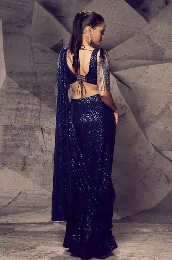The shimmering blue slit saree