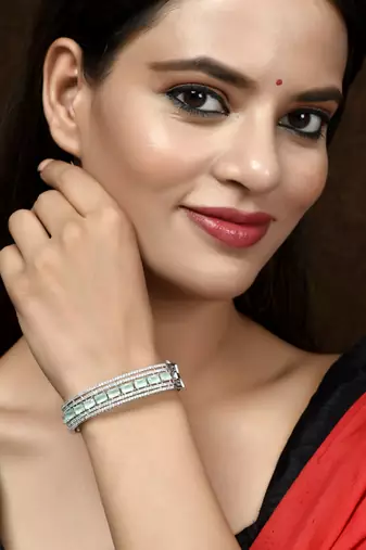 Women silver plated ad sea green stone studded bangle srtyle bracelet