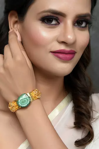 Gold plated green stone studded kada bracelet