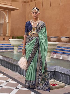 Elora Woven Designed Patola Silk Blend Saree (Green) 1
