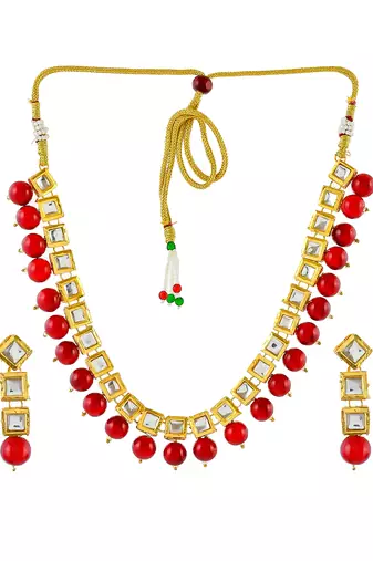 Women gold-plated & red kundan stone-studded jewellery set