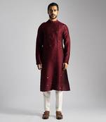 Deep red kurta with a cream pant