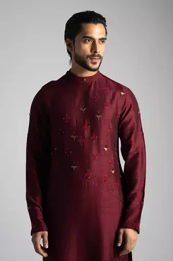 Deep red kurta with a cream pant