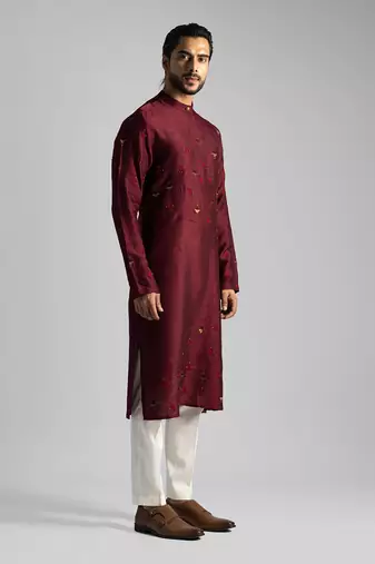 Deep red kurta with a cream pant