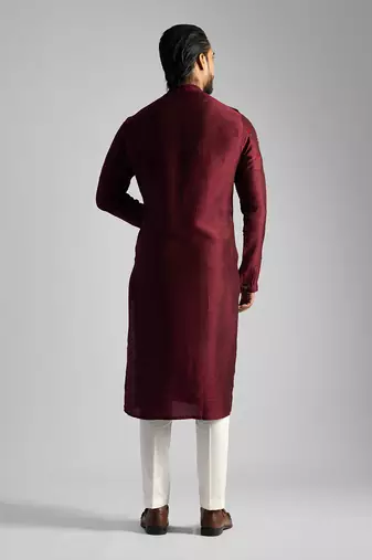 Deep red kurta with a cream pant