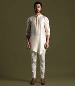 Cream asymmetric cut silk kurta with cream pants